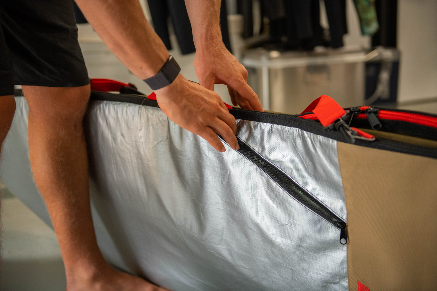 John John Florence and the VEIA JJF Day Bag with slanted side accessories pocket.