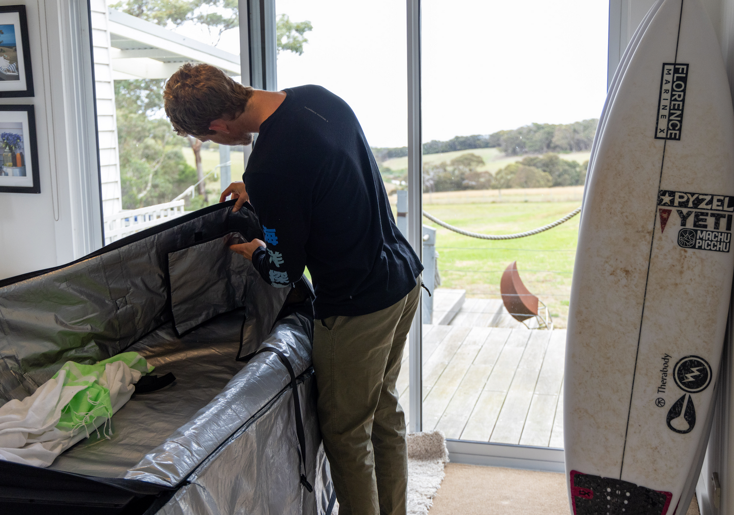 John John Florence using the internal nose reinforcement in the VEIA JJF Tour Bag