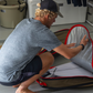 John John Florence putting a board into his VEIA JJF Day Bag 
